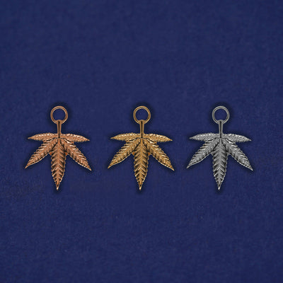 Three versions of the Pot Leaf Charm shown in options of yellow, white, and rose gold