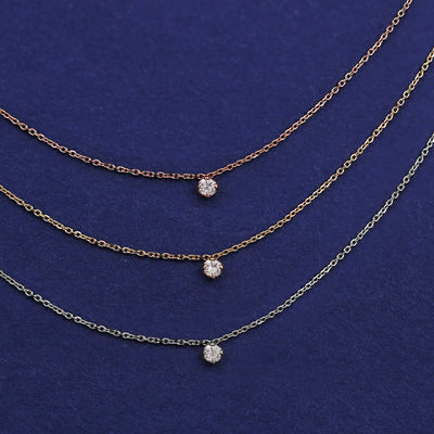 Three Diamond Cable Necklaces shown in options of rose, yellow, and white gold