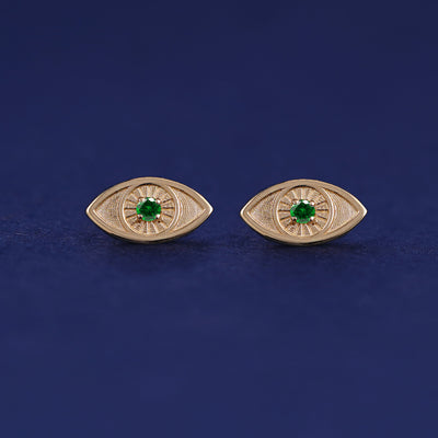 A pair of 14 karat solid gold emerald Evil Eye Earrings