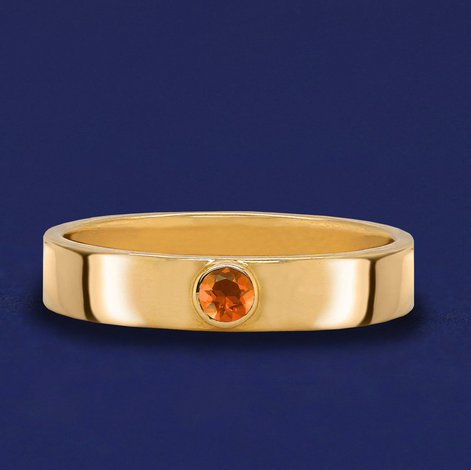 A solid yellow gold Fire Opal Gemstone Industrial ring