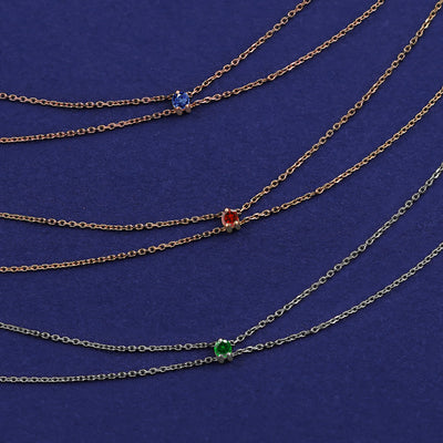 Three Gemstone Cable Bracelets shown in options of rose, yellow, and white gold