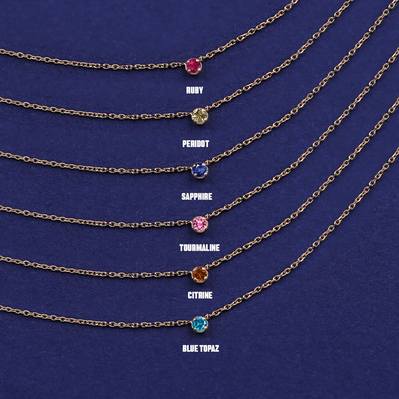 Six versions of the solid yellow gold Gemstone Cable Necklace showing different birthstone options