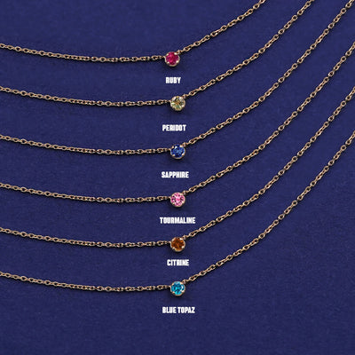 Six versions of the solid yellow gold Gemstone Cable Necklace showing different birthstone options
