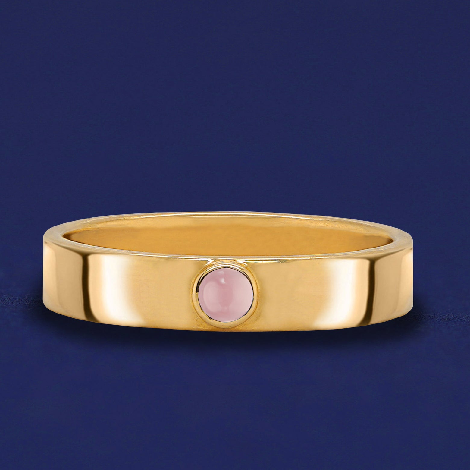 A solid yellow gold Rose Quartz Gemstone Industrial ring