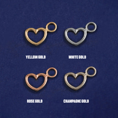 Four versions of the Heart Charm shown in options of yellow, white, rose and champagne gold