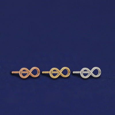 Three versions of the Infinity Earrings shown in options of rose, yellow, and white gold