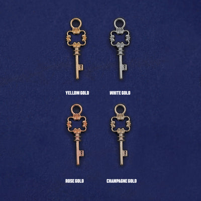 Four versions of the Key Charm shown in options of yellow, white, rose and champagne gold