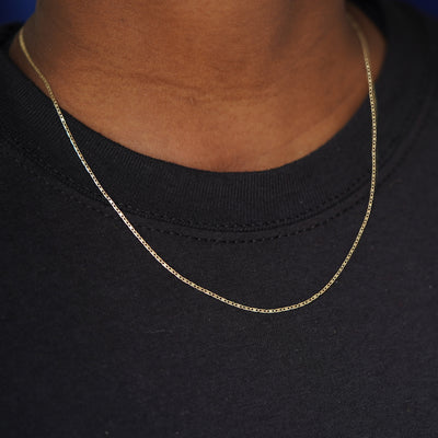 A model wearing a 14k yellow gold Valentine Chain