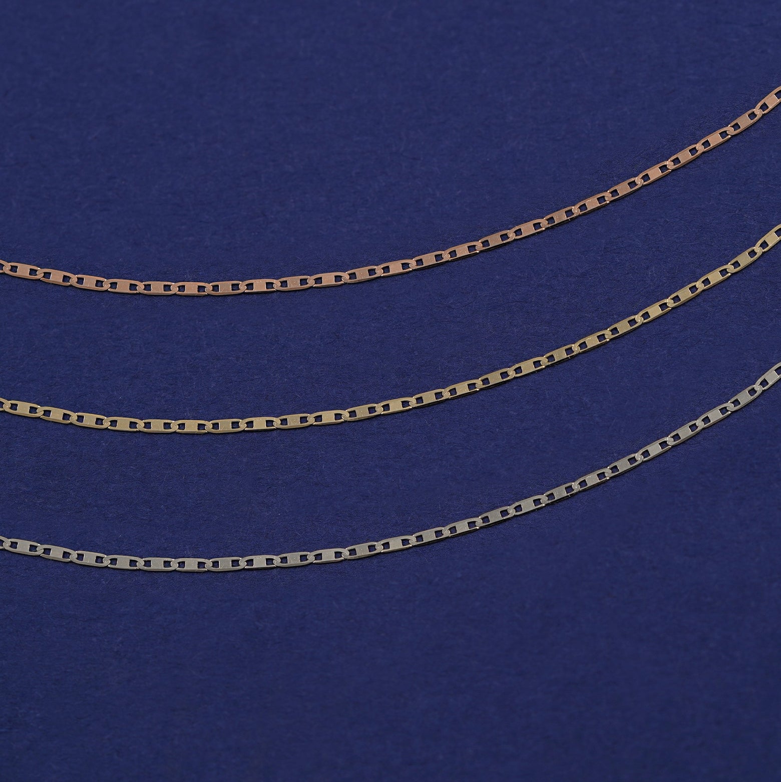 Three Valentine Chains shown in options of rose, yellow, and white gold