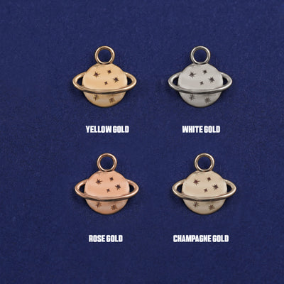 Four versions of the Saturn Charm shown in options of yellow, white, rose and champagne gold