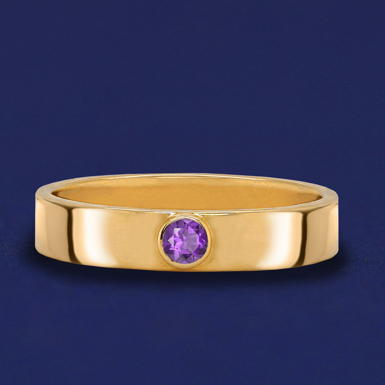 A solid yellow gold Amethyst Gemstone Industrial ring