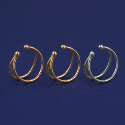 Three versions of the Double Cuff shown in options of rose, yellow, and white gold