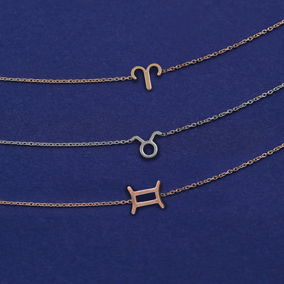 Three Horoscope Bracelets in zodiac symbols of Aries, Taurus and Gemini in yellow, white, and rose gold respectively