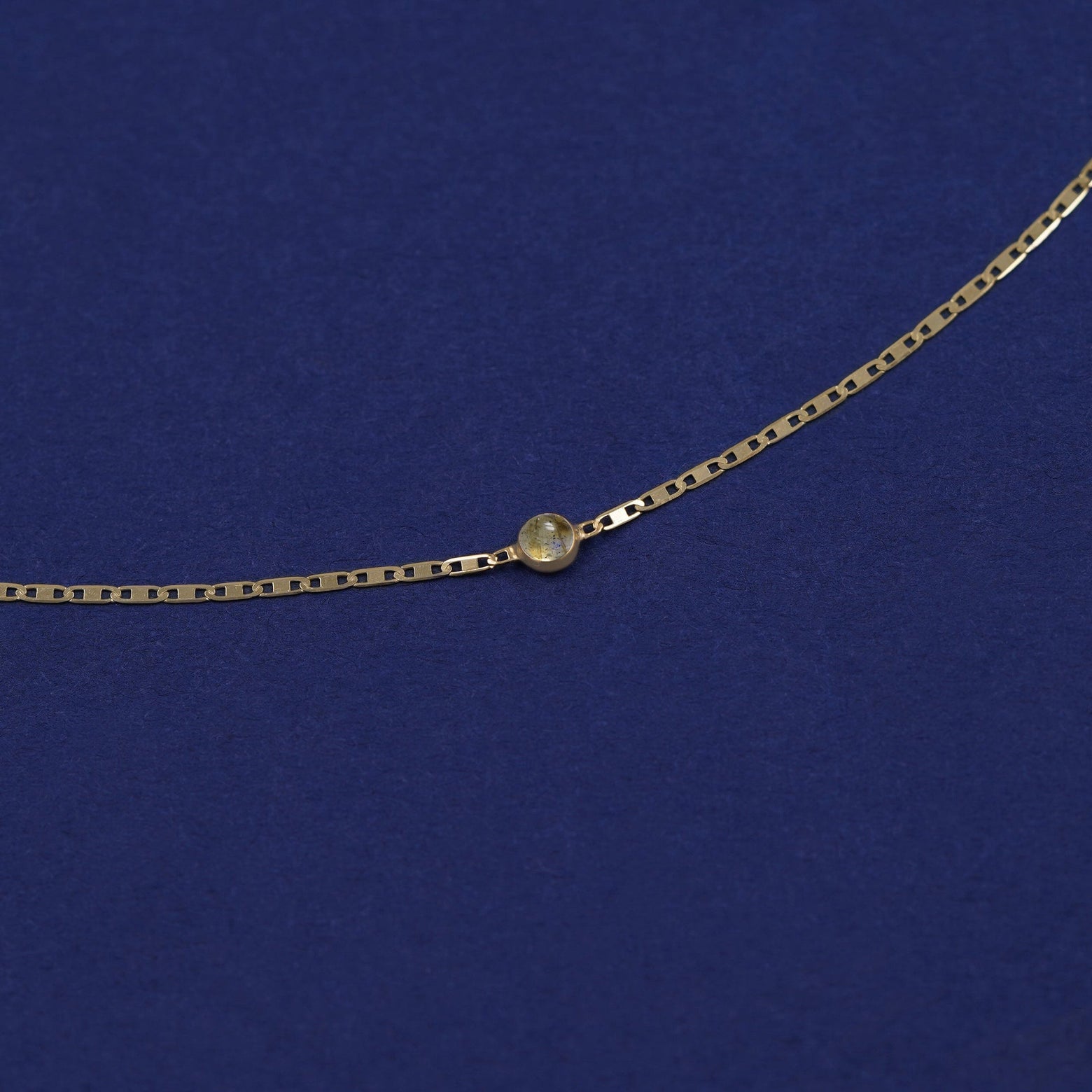 Bezel set Labradorite solitaire on a 14 karat gold Valentine chain bracelet