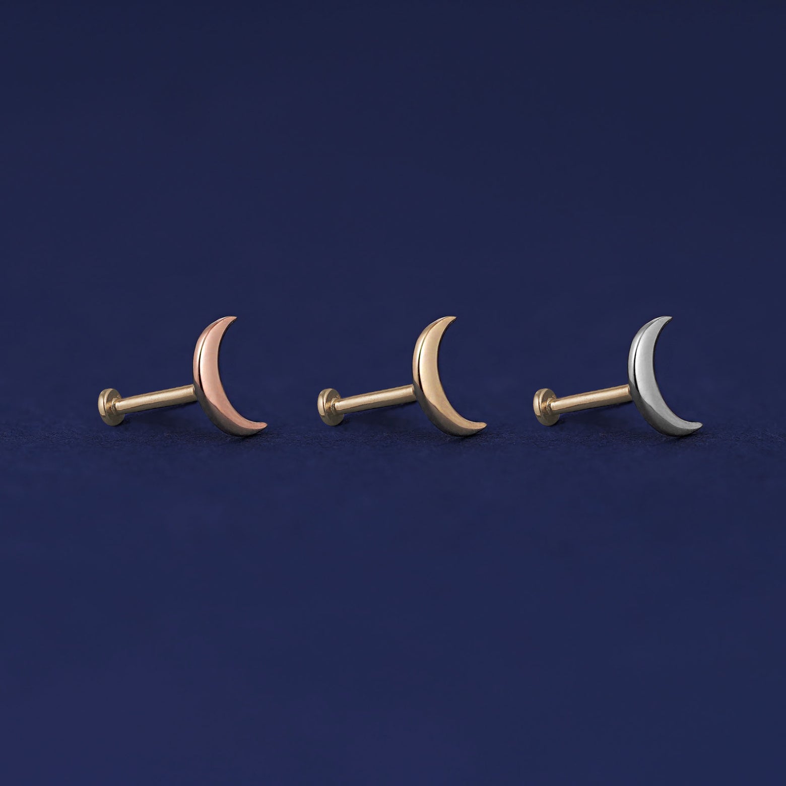 Three versions of the Moon Flat Back Earring shown in options of rose, yellow, and white gold