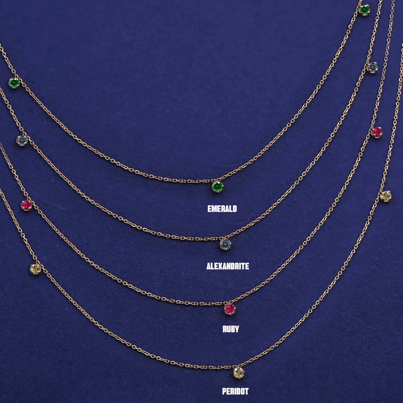 Four versions of the solid yellow gold 3 Gemstone Cable Necklace showing different birthstone options